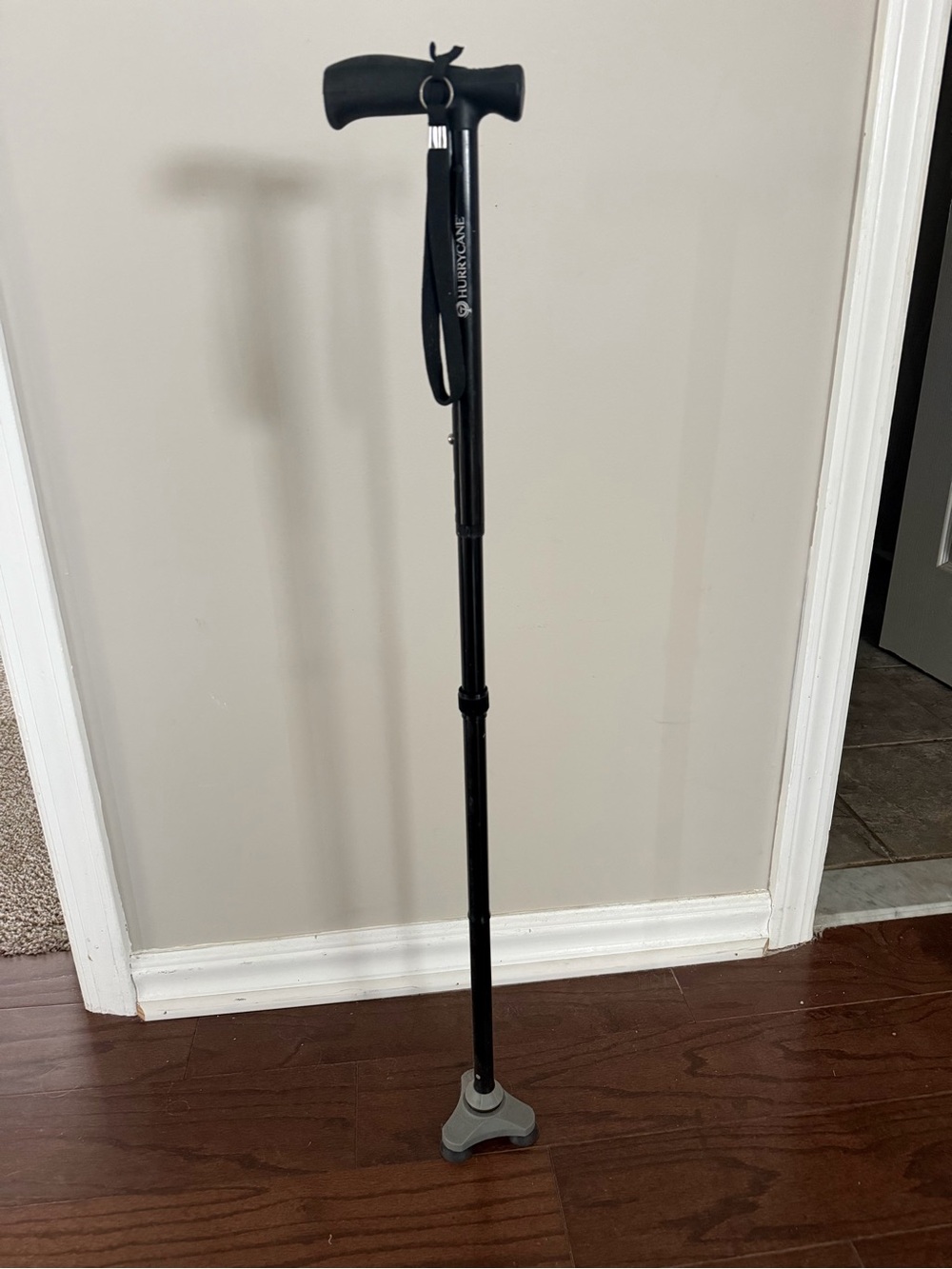 Adjustable Black Walking Cane with Tri-Base Support